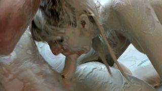Three women covered in mud fuck in the ring